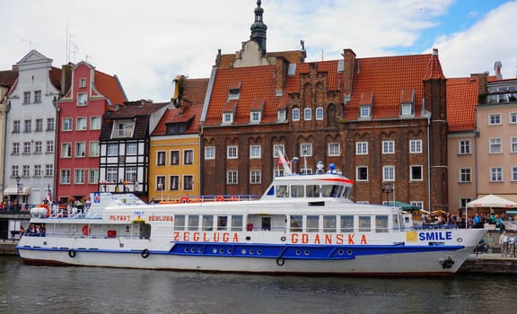 GDANSK, POLAND - JULY 29, 2015: Tourist boat Zegluga on a river in the city center