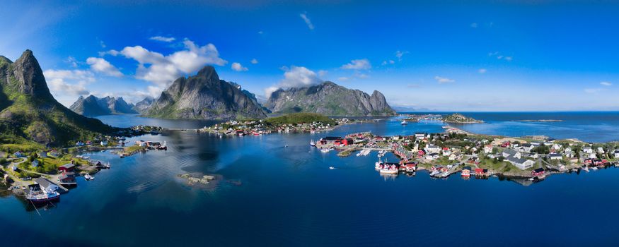 Breathtaking aerial panorama of fishing town Reine and surrounding fjords on Lofoten islands in Norway, famous tourist destination