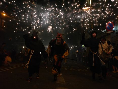 SPAIN, Barcelona; Correfoc, or Firerun, is a traditional Catalan festival held in Barcelona on September 20, 2015, in which groups of people dressed as devils light fireworks. 	The fireworks are directed towards the crowds, and spectators can join in and try to get as close as possible to the fireworks without getting burned. 