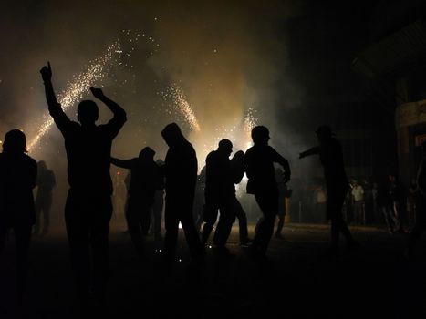 SPAIN, Barcelona; Correfoc, or Firerun, is a traditional Catalan festival held in Barcelona on September 20, 2015, in which groups of people dressed as devils light fireworks. 	The fireworks are directed towards the crowds, and spectators can join in and try to get as close as possible to the fireworks without getting burned. 