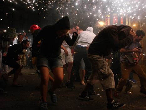 SPAIN, Barcelona; Correfoc, or Firerun, is a traditional Catalan festival held in Barcelona on September 20, 2015, in which groups of people dressed as devils light fireworks. 	The fireworks are directed towards the crowds, and spectators can join in and try to get as close as possible to the fireworks without getting burned. 