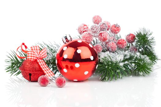 Christmas balls and fir branches with decorations isolated over white