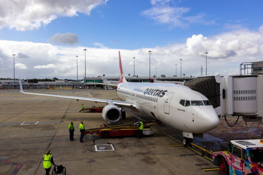 MELBOURNE/AUSTRALIA - SEPTEMBER 22, 2015: Heavy Jetliners parked at passenger terminal taking on passengers