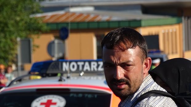 GERMANY, Freilassing: Refugees being stopped by police as they enter Germany from Austria at Freilassing train station, on September 21, 2015. 	The station has become a huge processing camp for migrants heading to Germany, following strict border controls being introduced. German police are now boarding trains from Austria and checking the documents of travellers. 