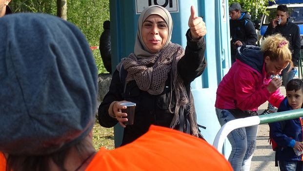 GERMANY, Freilassing: Refugees being stopped by police as they enter Germany from Austria at Freilassing train station, on September 21, 2015. 	The station has become a huge processing camp for migrants heading to Germany, following strict border controls being introduced. German police are now boarding trains from Austria and checking the documents of travellers. 