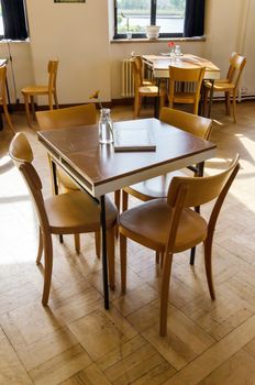 Wooden Tables and chairs in restaurant.