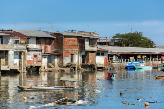 poor houses with sheet tin by the river, Kota Manado, North Sulawesi, Indonesia