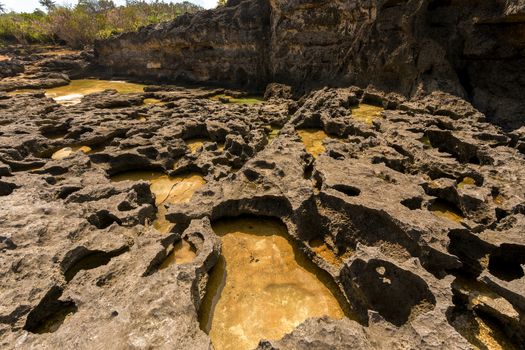 rock formation on dream coastline at Bali, near Manta Point famous Diving place, Nusa Penida with blue sky