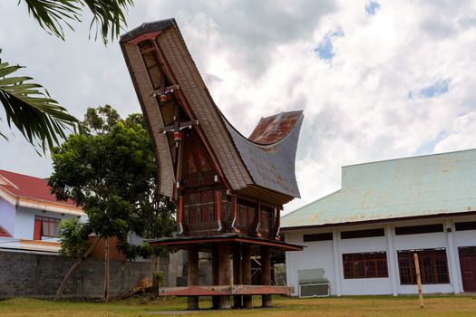Details of outstanding local Toraja ethnic architecture, wood carvings, paintings and traditional decoration with rooster in Bitung city, North Sulawesi (celebes) Indonesia