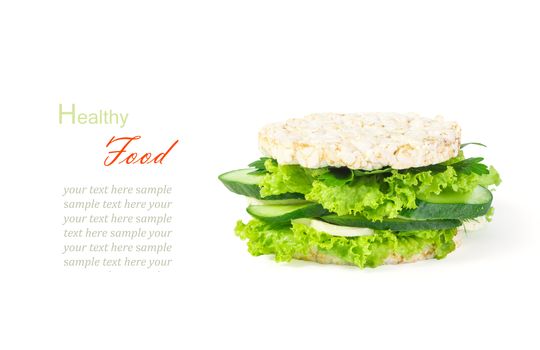 The concept of a healthy food, diet, losing weight, vegeterian. A healthy burger with wholegrain cereal crispbreads, vegetables, herbs and cheese. Isolated on white background, close up.