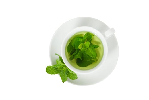 Mint tea with fresh mint in a white cup, top view, closeup, isolated on white
