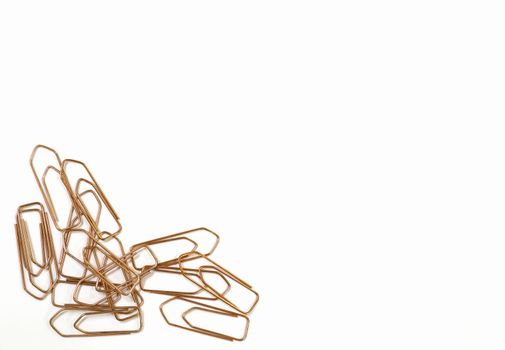 Close-up of paper clips on a white background.