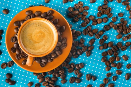 ceramic cup with coffee  espresso on a bright blue background, top view