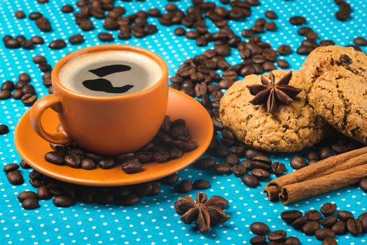 ceramic cup with coffee espresso on a bright blue background, oatmeal cookies, cinnamon, star anise, top view