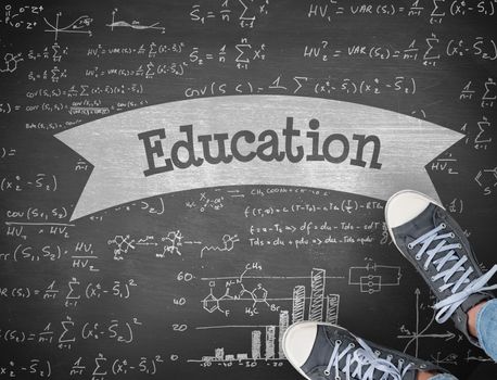 The word education and casual shoes against black background