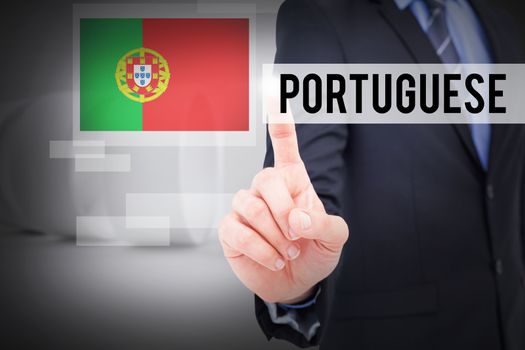 The word portuguese and mid section of businessman pointing something up against white abstract room