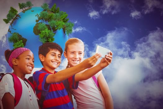 Happy kids taking selfie in school corridor against digitally generated earth floating in air