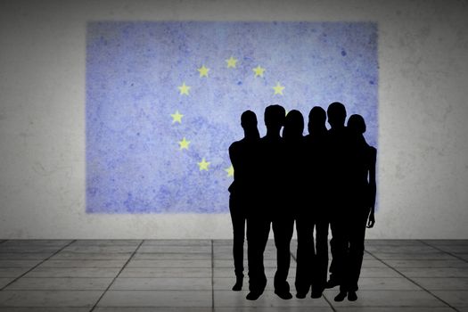 Silhouette of team of people against eu flag