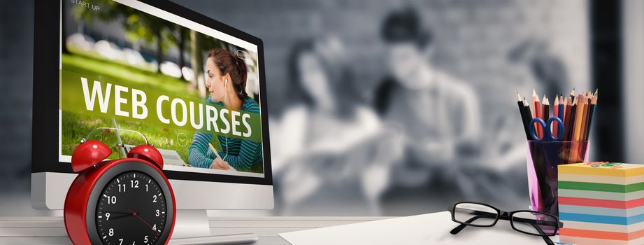 Computer screen against happy students standing and reading