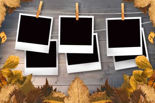 Autumn leaves pattern against bleached wooden planks background