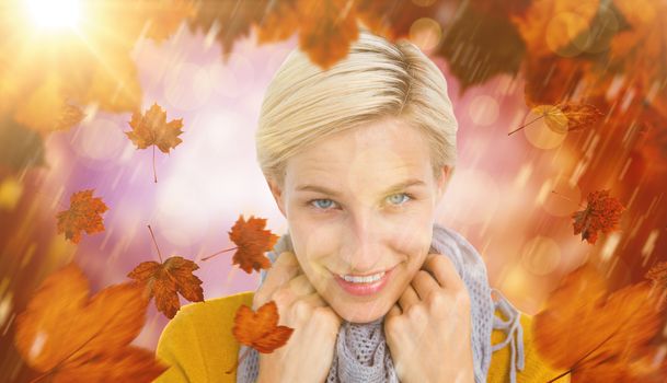 Smiling woman wearing a scarf against dark abstract light spot design