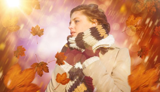 Thoughtful woman in winter clothes against dark abstract light spot design