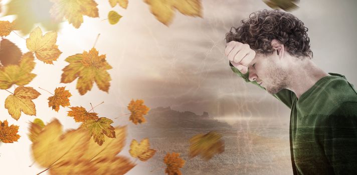 Depressed man over white background against autumn leaves