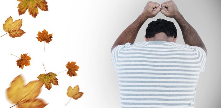 Upset man leaning on white background against autumn leaves pattern