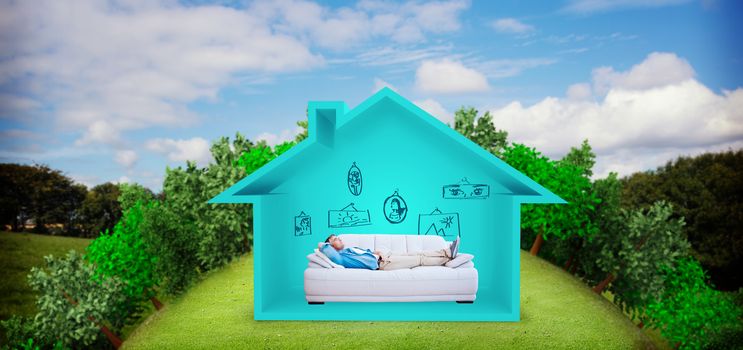 Side view of man resting on sofa against green field