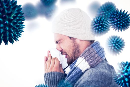 Handsome man in winter fashion blowing his nose against virus