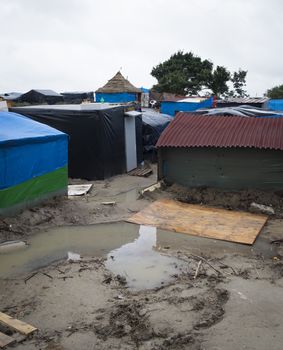 FRANCE, Calais: A typical street at the New Jungle refugee and migrant camp near Calais, France, on September 17, 2015.	Refugees and migrants trying to enter the UK from France are facing dropping temperatures and poor sanitation at the makeshift camp.