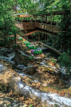 HATAY, TURKEY - JUNE 7, 2015 : Top view of restaurant with colourful table and chairs, settled in Harbiye Waterfall in Antakya.