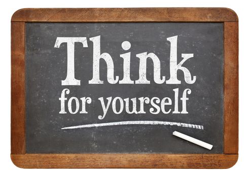 Think for yourself - motivational text in white chalk on a vintage slate blackboard