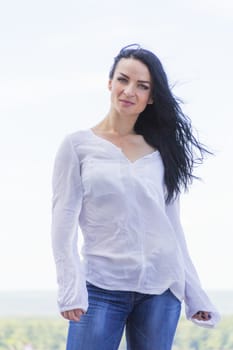 Photo of Caucasian brunette woman in white
