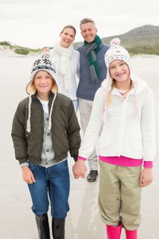 Happy family enjoying a nice day out at the beach