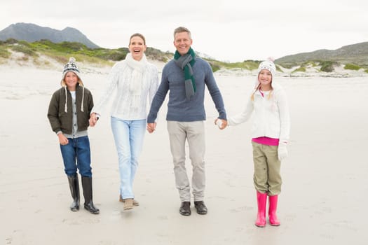 Happy family enjoying a nice day out at the beach