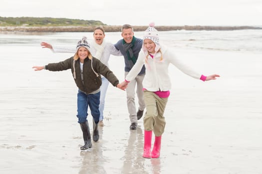 Happy family enjoying a nice day out at the beach