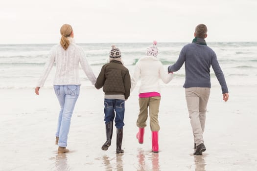 Happy family enjoying a nice day out at the beach