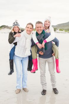 Happy family enjoying a nice day out at the beach