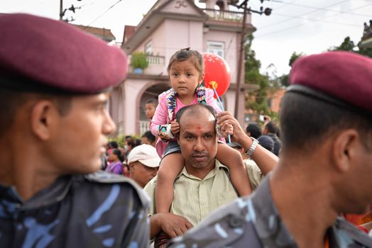 NEPAL, Patan: Hindu and Buddhist devotees celebrate the festival of rain god Rato Machindranath in Patan, Nepal on September 22, 2015. The festival takes place each April, but was delayed this year after a devastating earthquake damaged the chariot that devotees pull through the area in the hope of securing a good harvest.