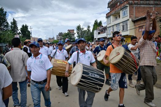 NEPAL, Patan: A group of drummers march during the festival of rain god Rato Machindranath in Patan, Nepal on September 22, 2015. The festival takes place each April, but was delayed this year after a devastating earthquake damaged the chariot that devotees pull through the area in the hope of securing a good harvest.