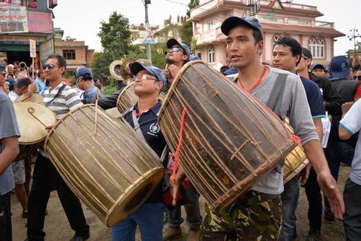 NEPAL, Patan: Drummers play as Hindu and Buddhist devotees celebrate the festival of rain god Rato Machindranath in Patan, Nepal on September 22, 2015. The festival takes place each April, but was delayed this year after a devastating earthquake damaged the chariot that devotees pull through the area in the hope of securing a good harvest.