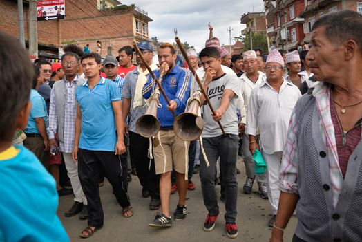 NEPAL, Patan: Hindu and Buddhist devotees celebrate the festival of rain god Rato Machindranath in Patan, Nepal on September 22, 2015. The festival takes place each April, but was delayed this year after a devastating earthquake damaged the chariot that devotees pull through the area in the hope of securing a good harvest.