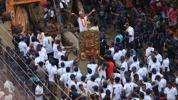 NEPAL, Patan: The restored chariot makes its way through Patan, Nepal as Hindu and Buddhist devotees celebrate the festival of rain god Rato Machindranath on September 22, 2015. The festival takes place each April, but was delayed this year after a devastating earthquake damaged the chariot that devotees pull through the area in the hope of securing a good harvest.