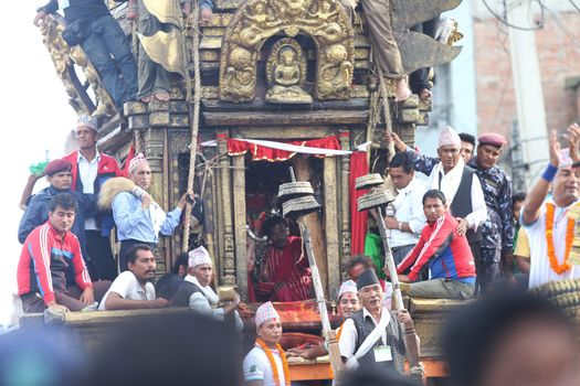 NEPAL, Patan: The restored chariot makes its way through Patan, Nepal as Hindu and Buddhist devotees celebrate the festival of rain god Rato Machindranath on September 22, 2015. The festival takes place each April, but was delayed this year after a devastating earthquake damaged the chariot that devotees pull through the area in the hope of securing a good harvest.