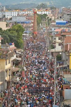 NEPAL, Patan: The restored chariot makes its way through Patan, Nepal as Hindu and Buddhist devotees celebrate the festival of rain god Rato Machindranath on September 22, 2015. The festival takes place each April, but was delayed this year after a devastating earthquake damaged the chariot that devotees pull through the area in the hope of securing a good harvest.