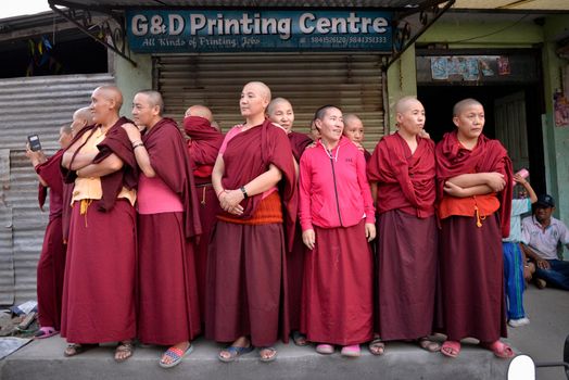 NEPAL, Patan: Buddhist devotees look on during the festival of rain god Rato Machindranath in Patan, Nepal on September 22, 2015. The festival takes place each April, but was delayed this year after a devastating earthquake damaged the chariot that devotees pull through the area in the hope of securing a good harvest.