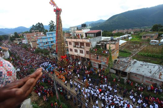 NEPAL, Patan: The restored chariot makes its way through Patan, Nepal as Hindu and Buddhist devotees celebrate the festival of rain god Rato Machindranath on September 22, 2015. The festival takes place each April, but was delayed this year after a devastating earthquake damaged the chariot that devotees pull through the area in the hope of securing a good harvest.