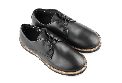 Male classic black leather stylish shoes with laces close up, top view