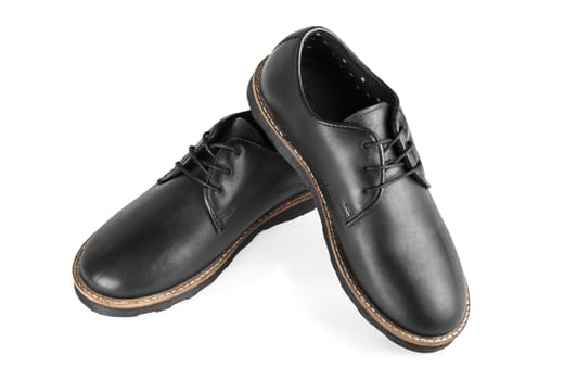 Male classic black leather stylish shoes with laces close up, top view